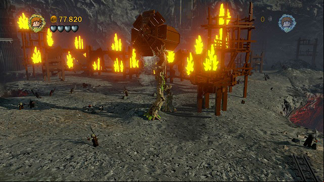 Keep going further to the right and you should reach a wall of fire - Osgiliath - Walkthrough - Act II - LEGO The Lord of the Rings - Game Guide and Walkthrough