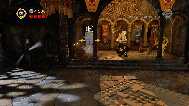 On the left side of the throne you will find a mithril statue - Warg Attack - Collectibles - LEGO The Lord of the Rings - Game Guide and Walkthrough