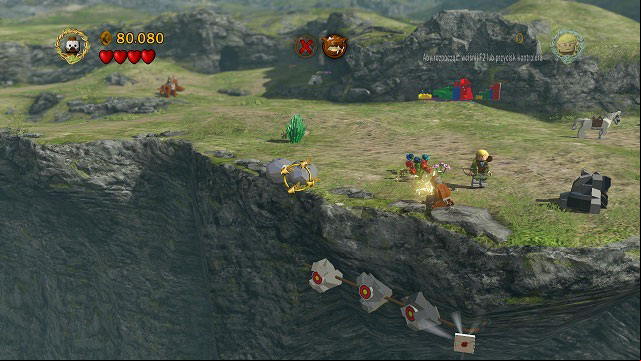 From where you gained Minikit #10, head towards the camera to the edge of the cliff to find mithril rocks - blow them up with Berserker's bombs - Warg Attack - Collectibles - LEGO The Lord of the Rings - Game Guide and Walkthrough