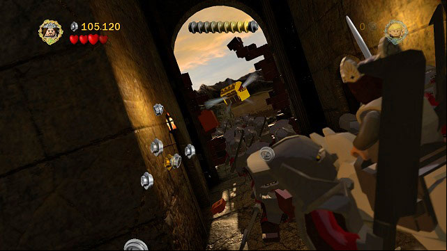 During the horse ride, when you're controlling Theoden - in the entrance gate, you need to jump to it - Helms Deep - Collectibles - LEGO The Lord of the Rings - Game Guide and Walkthrough