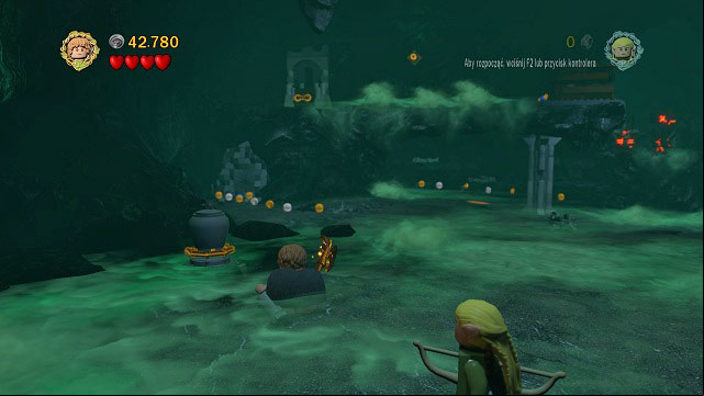 The obtained sacrifice has to be placed on the altar which you can receive after pulling the orange handle on a rock ledge in the same room - The Paths of the Dead - Collectibles - LEGO The Lord of the Rings - Game Guide and Walkthrough