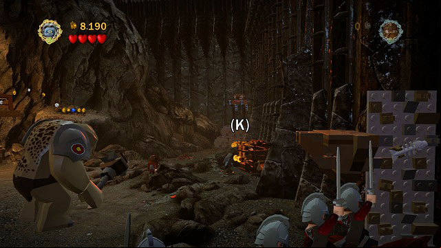 When the fight moves to the left, just pull the orange handle with Shagrat and the chest will be yours - The Black Gate - Collectibles - LEGO The Lord of the Rings - Game Guide and Walkthrough