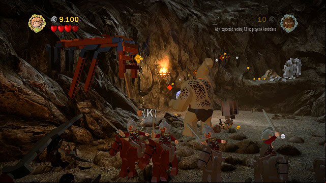 Right beside the place where you attached the rope while collecting Minikit #4, there is some loose ground - dig it up and pick up the chest - The Black Gate - Collectibles - LEGO The Lord of the Rings - Game Guide and Walkthrough