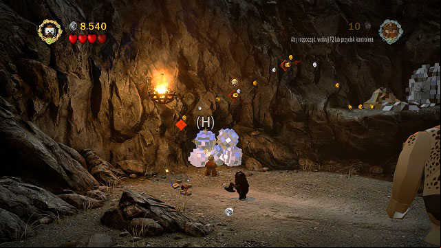 During the second battle to the left of the gate, in the distance you should see mithril boulders - The Black Gate - Collectibles - LEGO The Lord of the Rings - Game Guide and Walkthrough