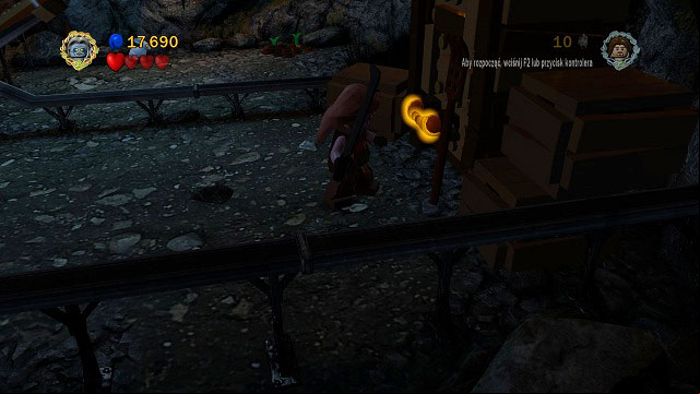 In the same location as Minikit #5; pull the orange handle with Shagrat and pick up the treasure - The Black Gate - Collectibles - LEGO The Lord of the Rings - Game Guide and Walkthrough