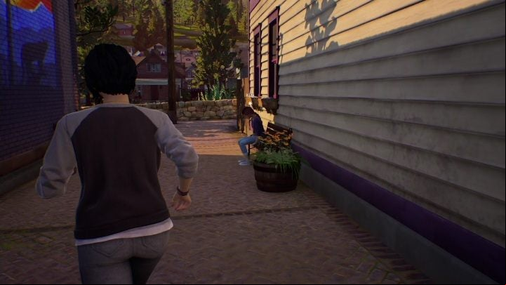 Riley's sitting on a bench right behind Charlotte's store - Life is Strange True Colors: Mac - walkthrough - Episode 2 Lanterns - Life is Strange True Colors Guide