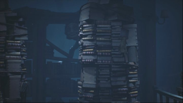 Focusing on the sounds and the woman in the background, you have to sense the right moment to jump to the other stack of books - Little Nightmares 2: The Library - Chapter 2 Orphanage walkthrough - Chapter 2 - Orphanage - Little Nightmares 2 Guide