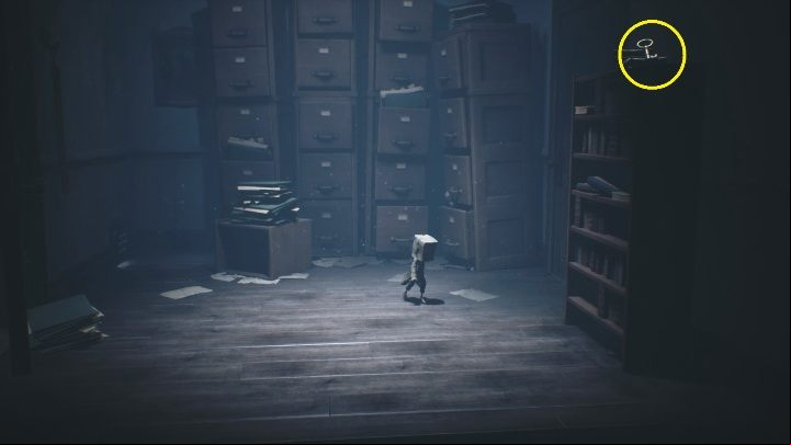 The key is located on the cabinet, to get to it you have to knock it over - Little Nightmares 2: School - Chapter 2 Orphanage walkthrough - Chapter 2 - Orphanage - Little Nightmares 2 Guide