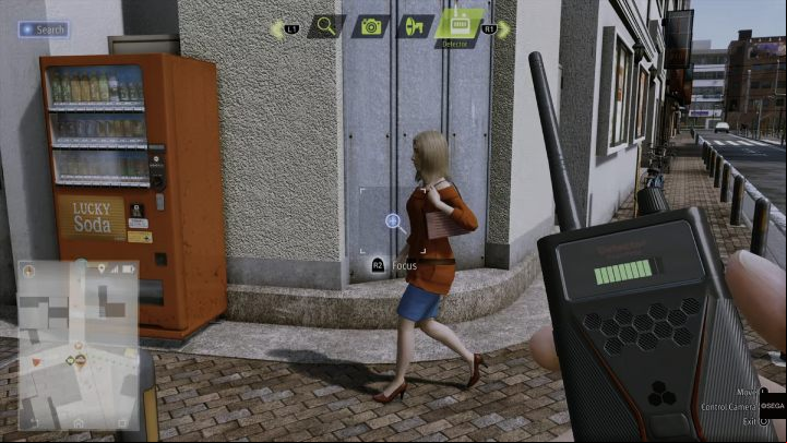 Using the detector, examine the woman in the red sweater - Lost Judgment: Dastardly Detective, The Wandering Bug - walkthrough - Side Cases - Lost Judgment Guide