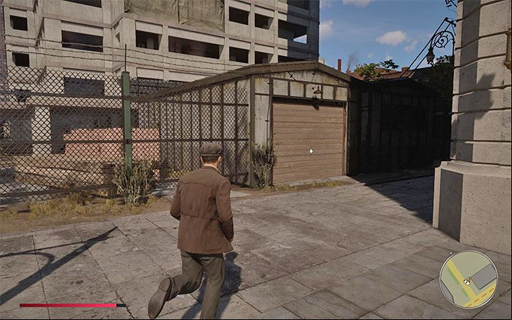 Go around the construction site until you find a garage with a secret vehicle shown in the picture - Mafia Definitive Edition: Fleme Spearr - hidden car, where to find - Cars - Mafia Definitive Edition Guide, Walkthrough