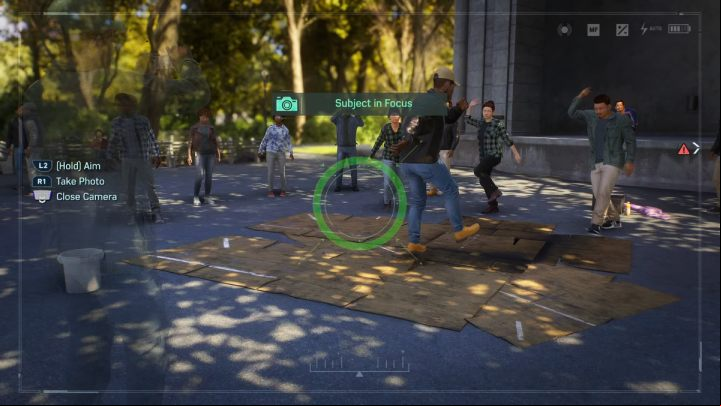 In the southern part of the park, take a picture of people dancing by the stage - Spider-Man 2: All Photo Ops - locations - Secrets and Collectibles - Spider Man 2 Guide