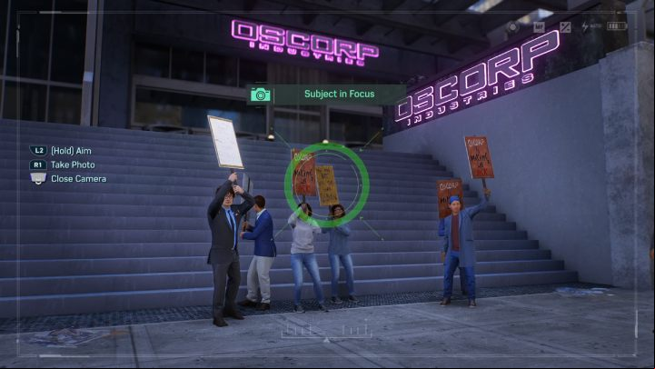 Take a picture of people protesting in front of the Oscorp headquarters building - Spider-Man 2: All Photo Ops - locations - Secrets and Collectibles - Spider Man 2 Guide