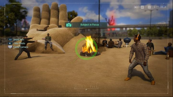 Take a picture of people throwing a frisbee by the fire - Spider-Man 2: All Photo Ops - locations - Secrets and Collectibles - Spider Man 2 Guide