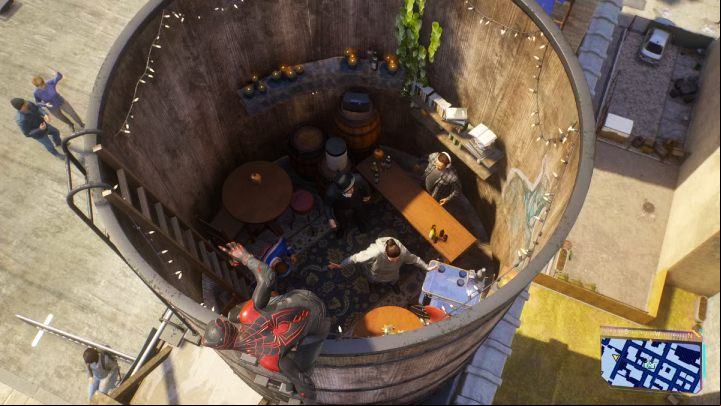 Take a picture of people partying in a huge barrel on the roof of a building - Spider-Man 2: All Photo Ops - locations - Secrets and Collectibles - Spider Man 2 Guide