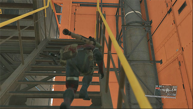 Get to the stairs and go to the upper part of the R&D platform - Eliminating the enemy commander | Walkthrough - Mission 22 - Retake the Platform - Metal Gear Solid V: The Phantom Pain Game Guide & Walkthrough