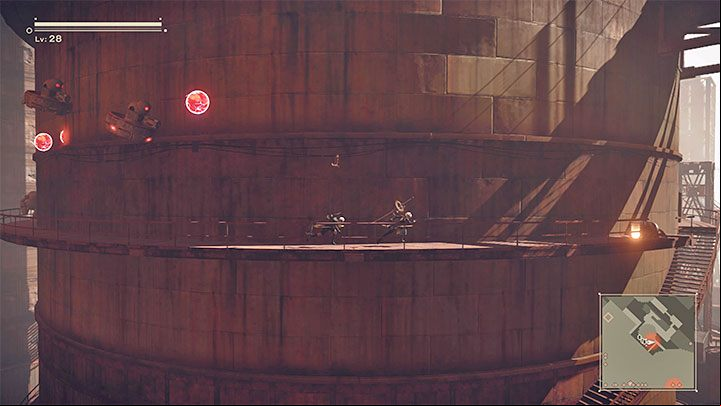 Data Chip E is at the end of one of the metal balconies surrounding the huge silo - NieR Automata: City Ruins - walkthrough, side quests - Side missions - NieR Automata Guide
