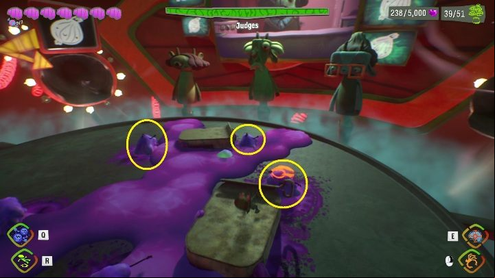 From time to time, the boss in the center will spit out several ingredients covered in sludge - Psychonauts 2: Judges boss fight - how to beat - Bosses - Psychonauts 2 Guide