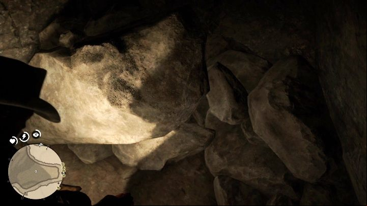 In the depths of the cave, among the many large rocks you will find gold bars - Red Dead Redemption 2: Gold bar - how to get, where to sell? - Exploring the game world - Red Dead Redemption 2 Guide