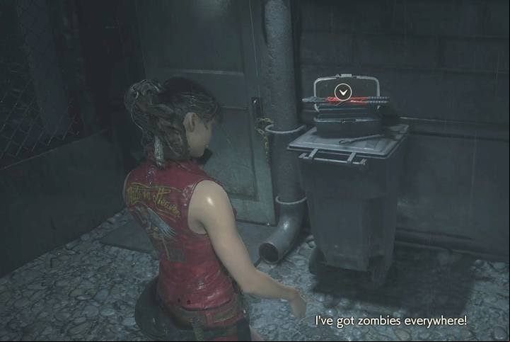 After the cut-scene, take the cutting tool lying on the barrel near the door (the ground floor) - Meet with the visitor (cutting tool) task | Police station in Resident Evil 2 - Walkthrough - Resident Evil 2 Guide