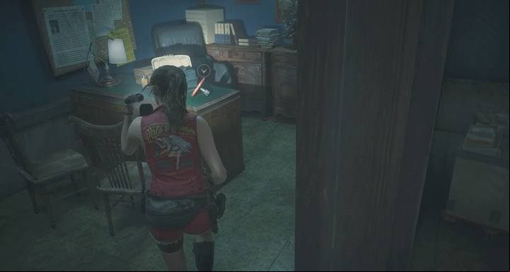 The round handle is on the desk in the smaller office. - Meet with the visitor (cutting tool) task | Police station in Resident Evil 2 - Walkthrough - Resident Evil 2 Guide