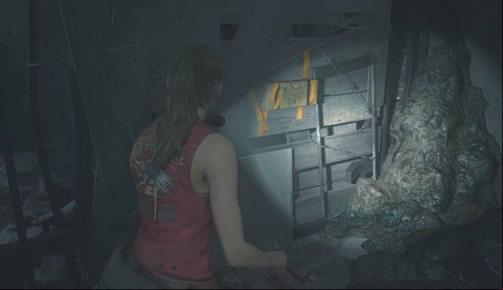 Reach the third floor and go to the room at the end of the corridor, the one adjacent to the library (west storage room, 3F) - Collect 3 medallions task | Police station in Resident Evil 2 - Walkthrough - Resident Evil 2 Guide