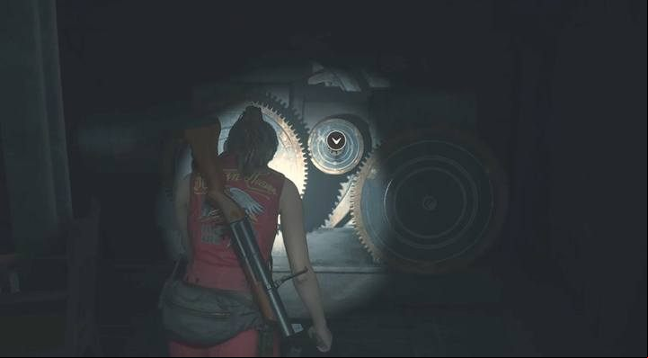 The first mechanism is right of the entrance to the clock tower - insert the large gear to lower the stairs - Escaping from the police station | Police station in Resident Evil 2 - Leons path - Resident Evil 2 Guide