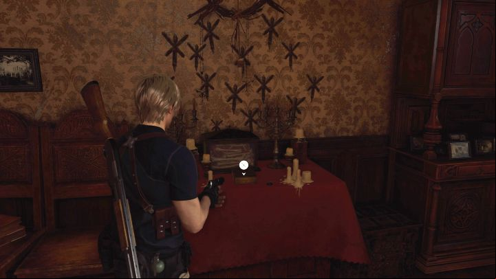 Look inside a room on the first floor of Village Chief's Manor - the one unlocked after completing the Door with Round Slot puzzle - Resident Evil 4 Remake: Files map - Village - Secrets - Resident Evil 4 Remake Guide