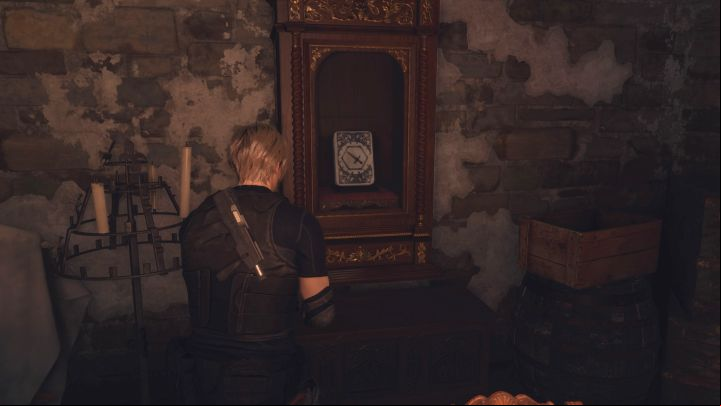 Lithographic Stone D is in a glass case you must break (use your knife) - Resident Evil 4 Remake: The Bindery Lithographic Stones puzzle (Chapter 8) - Puzzle solutions - Resident Evil 4 Remake Guide
