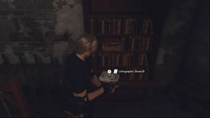 Lithographic Stone B is next to a bookshelf - Resident Evil 4 Remake: The Bindery Lithographic Stones puzzle (Chapter 8) - Puzzle solutions - Resident Evil 4 Remake Guide