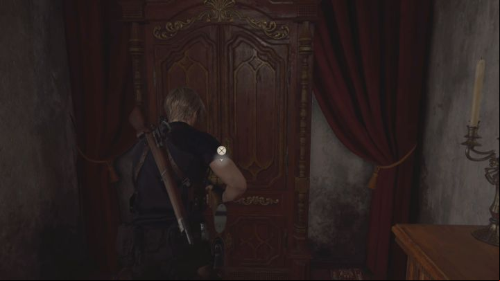 Return to the first floor and find the locked cabinet pictured above - that's where you'll find the Combination Lock - Resident Evil 4 Remake: Puzzles in the Village Chiefs Manor (Chapter 2) - Puzzle solutions - Resident Evil 4 Remake Guide