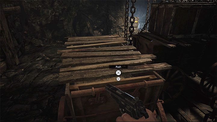 Push the first cart to the side and the second one down - Resident Evil Village: Necklace with Two Holes - how to complete? - Puzzle solutions - Resident Evil Village Guide