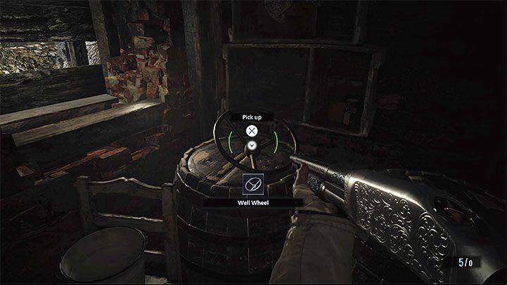 Inside the small building, you will find the Well Wheel - this is the item you need - Resident Evil Village: The well - how to start the mechanism? - FAQ - Resident Evil Village Guide