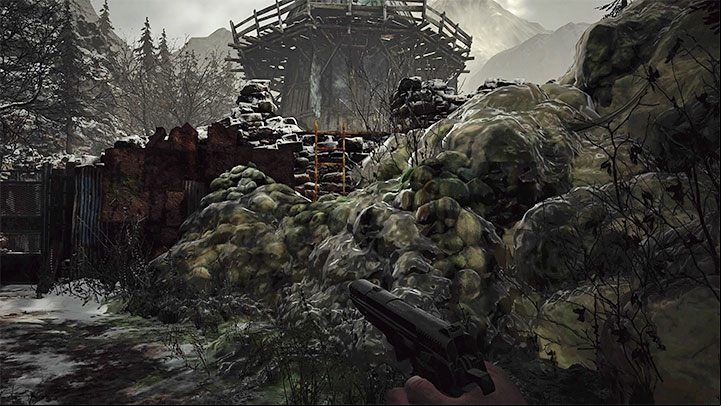Walk along the narrow path until you reach another slime barrier - Resident Evil Village: Going through the village to the boat - walkthrough - Fortress - Resident Evil Village Guide