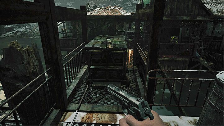 You will reach a new large wrecked building - Resident Evil Village: Going through the reservoir, avoiding the fish - walkthrough - Fortress - Resident Evil Village Guide