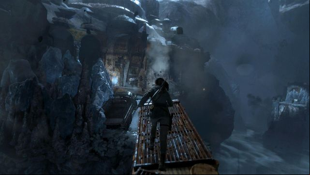 Over the slanting crane, run towards the gate quickly and take a leap, at the end that saves Laras life - Rise of the Tomb Raider: Break through the door, walkthrough - Shortcut - Rise of the Tomb Raider Guide