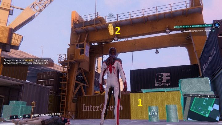 To get to the container (1), you must first use the lever (2) - Spider-Man Miles Morales: Robbers Target Local Biz - walkthrough - Side missions - Spider-Man Miles Morales Guide