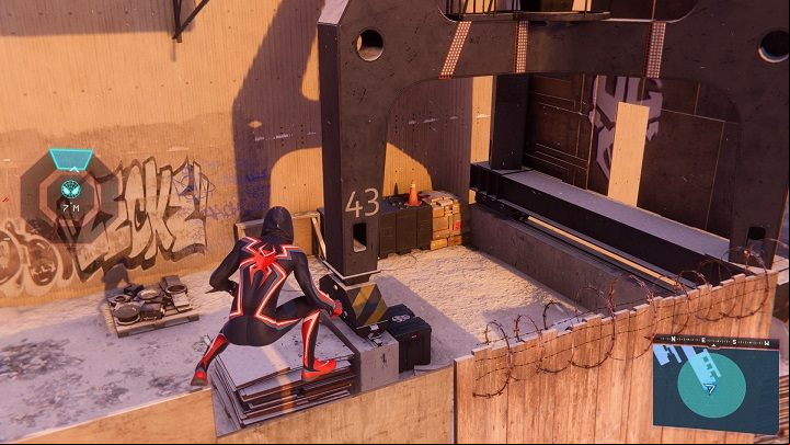 3) The next cache is located in the district's docks - Spider-Man Miles Morales: All Underground Caches - list - Collectibles - Spider-Man Miles Morales Guide