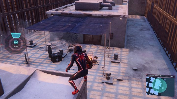 2) The next cache is located on the roof of the skyscraper by the river - Spider-Man Miles Morales: All Underground Caches - list - Collectibles - Spider-Man Miles Morales Guide