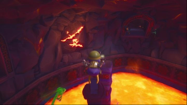 After connecting the heads to all of the statues, you will be asked to destroy some of the rock - Molten Crater | Spyro: Year of the Dragon Walkthrough - Sunrise Spring - Spyro Reignited Trilogy Guide