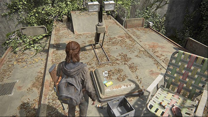 The trading card is on the roof next to the sunbed - The Last of Us 2: The Gate - collectibles, artefacts, coins - Seattle Day 1 - Ellie - The Last of Us 2 Guide