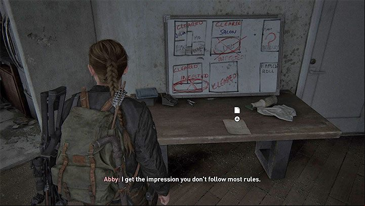 The document is on a table next to a whiteboard which contains a drawing of flats - The Last of Us 2: The Shortcut - collectibles, artefacts, coins - Seattle Day 2 - Abby - The Last of Us 2 Guide