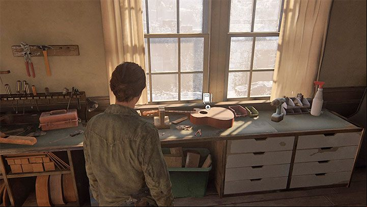 On the first floor of Joels house in the Packing Up stage go into the music room and interact with the guitar from the picture above lying by the window - The Last of Us 2: Packing Up - collectibles, artefacts, coins - Jackson - The Last of Us 2 Guide