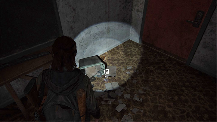 The trading card is on the floor of the motel room - The Last of Us 2: Capitol Hill - collectibles, artefacts, coins - Seattle Day 1 - Ellie - The Last of Us 2 Guide