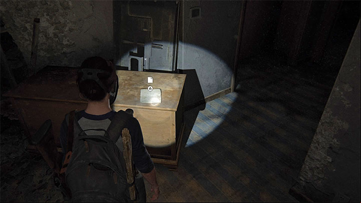 The document is on one of the furniture in Room 107 - The Last of Us 2: Finding Strings - collectibles, artefacts, coins - Seattle Day 2 - Ellie - The Last of Us 2 Guide