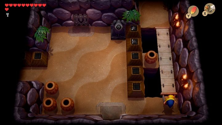 Use the Hookshot to pull out the wooden bridge and go through it to the next room - Catfishs Maw | Links Awakening Walkthrough - Walkthrough - Links Awakening Guide