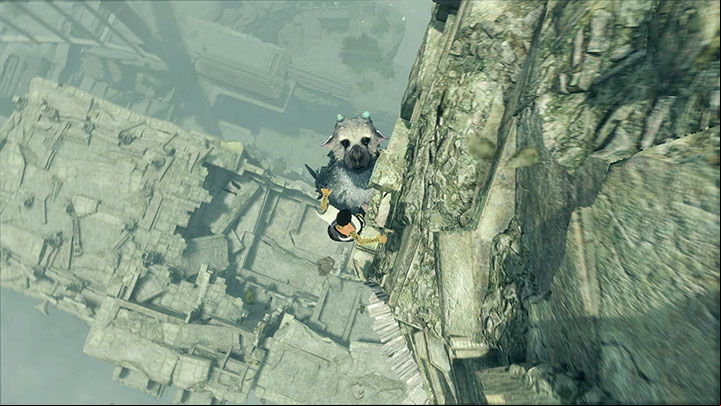 Once Trico hangs by the wall of the new tower, quickly get across to the small ledge, and move to the right to push the lever - Destroy the glass windows and explore the second tower | Walkthrough - Walkthrough - The Last Guardian Game Guide