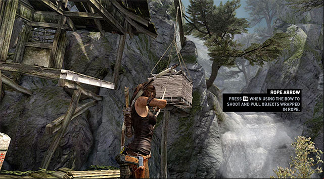 In order to unlock a way into the next location, shoot a rope arrow at the crate hanging from a hoist - Regroup with Roth | 9: A Road Less Traveled Walkthrough - 9: A Road Less Traveled | Walkthrough - Tomb Raider Game Guide