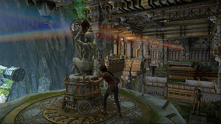 After you have used hook and rope to reach another part of the large cave, approach the first statue with a prism atop - Solution to the puzzle with prisms | Walkthrough - Walkthrough - Uncharted: The Lost Legacy Game Guide