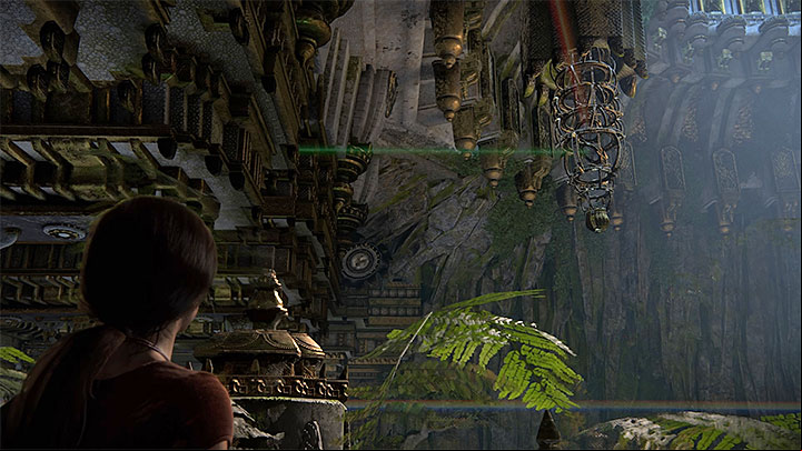 At this stage of the puzzle, the beam should reflect from the third statue and from the mirror inside the hanging cage in the center (the one you used to get here) - Solution to the puzzle with prisms | Walkthrough - Walkthrough - Uncharted: The Lost Legacy Game Guide