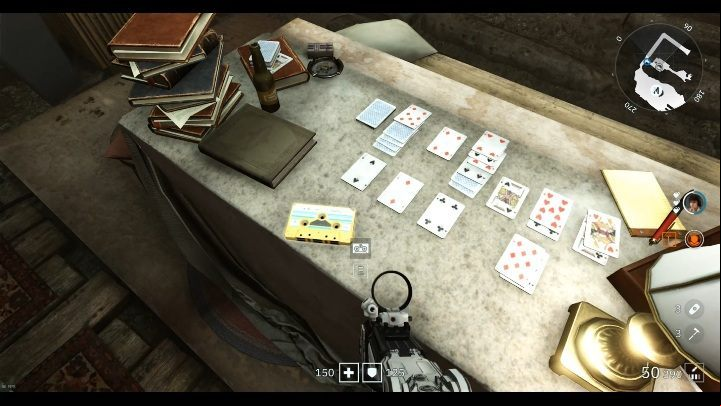 The light yellow cartridge is on the table, along with cards set for a game - Secrets and collectibles in Catacombs | Wolfenstein Youngblood - Collectibles and secrets - Wolfenstein Youngblood Guide